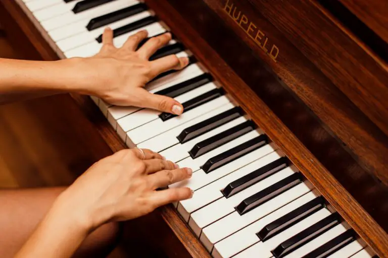 two hands playing piano